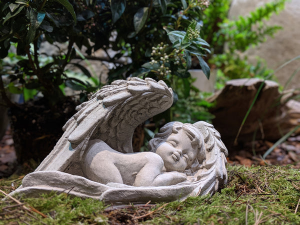 Angel in wings stone ornament