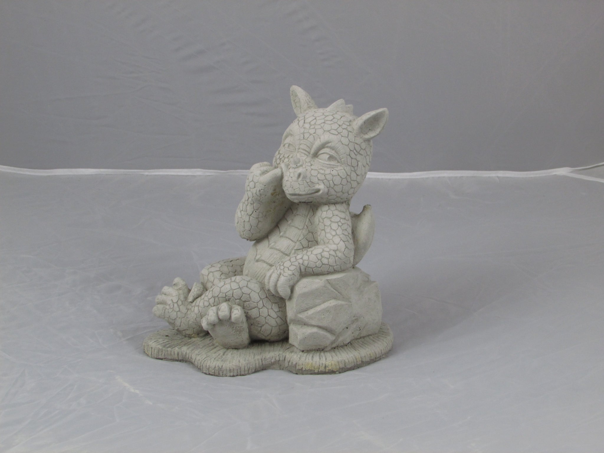 Nose picking dragon stone ornament