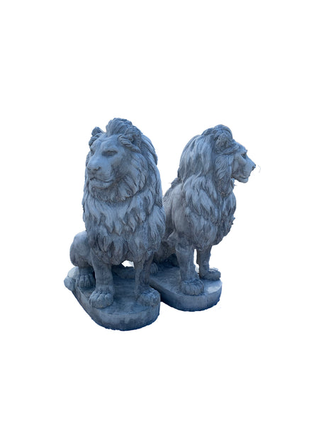 Large stone sitting lions pair